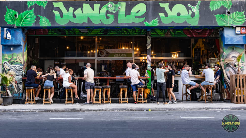 Front of Jungle Joy Bar and Restaurant in Gzira with people sitting and having drinks.