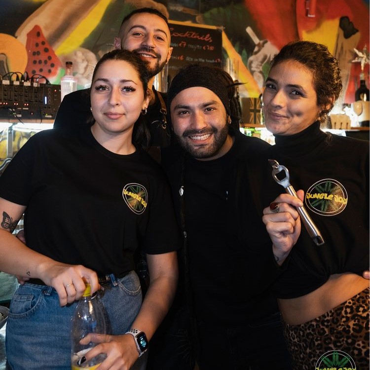 Cheerful Jungle Joy Bartenders Captured with Smiles Behind the Bar