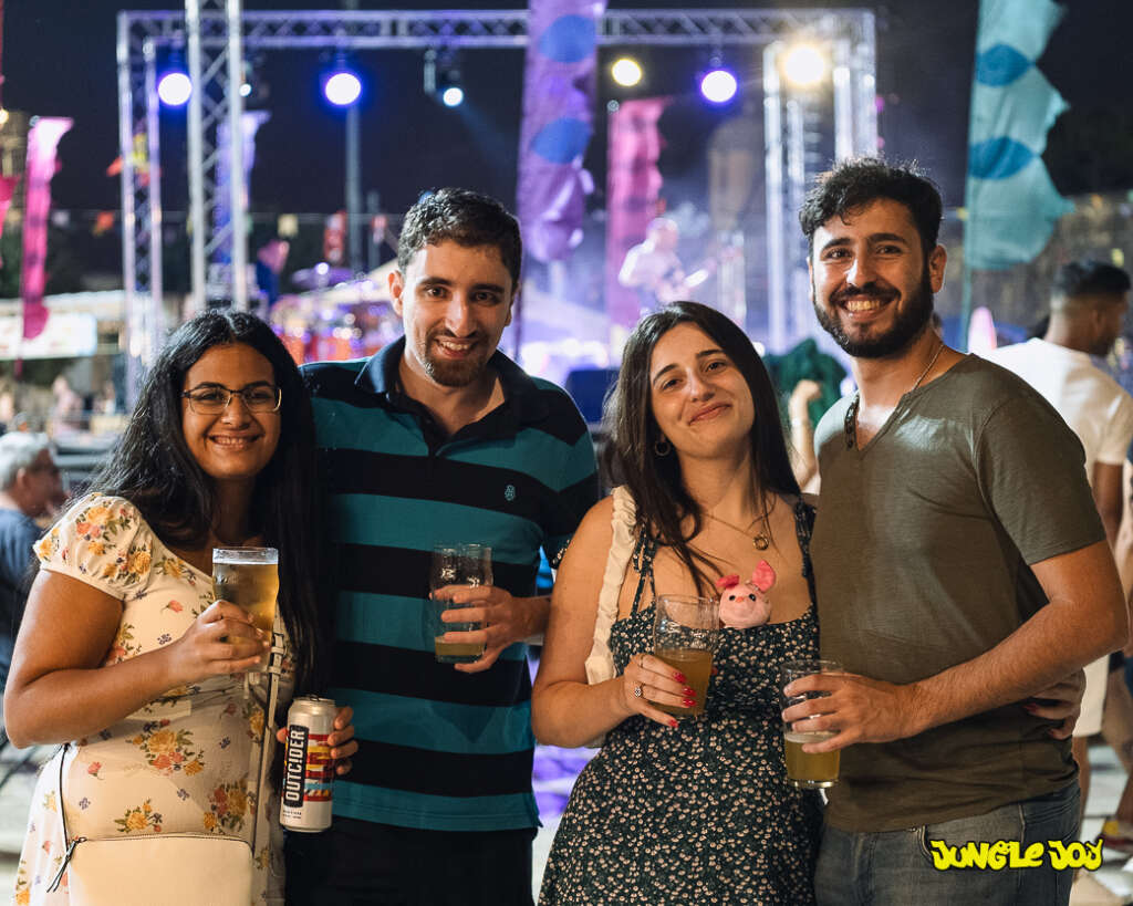 Group of four people smiling to the camera at the Pinta Beer Festival
